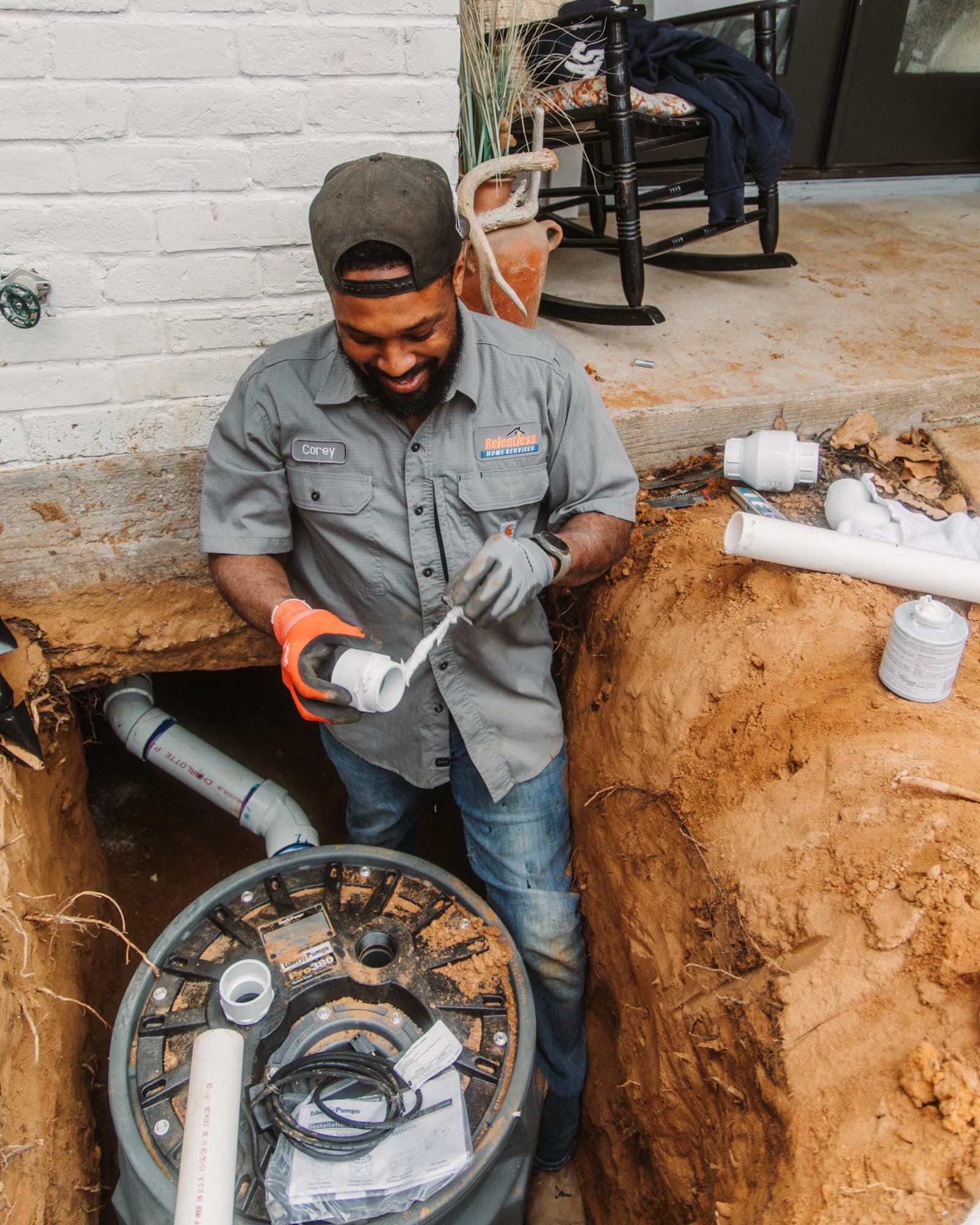 Relentless Home Services technician installing sewer line