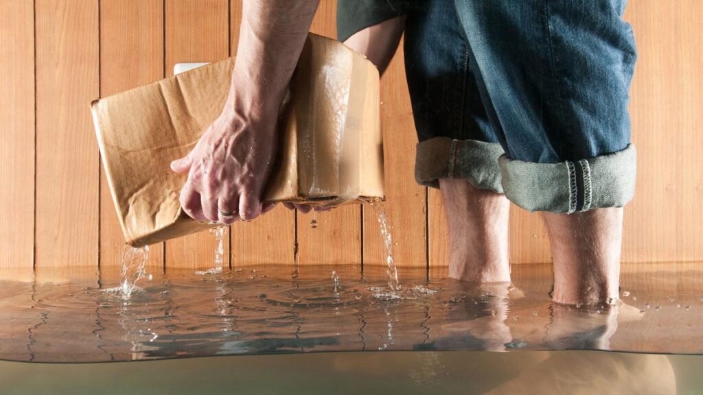 person in flooded basement