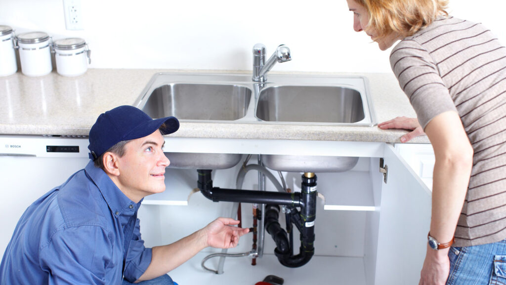 relentless plumbing solutions service van plumber explaining garbage disposal smell